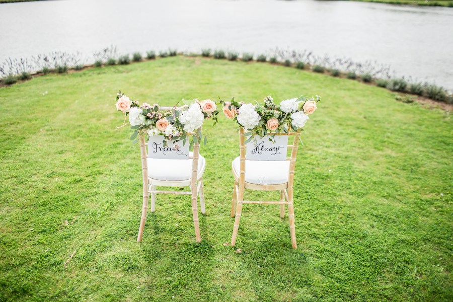 Outdoor wedding ceremony setup in a green field